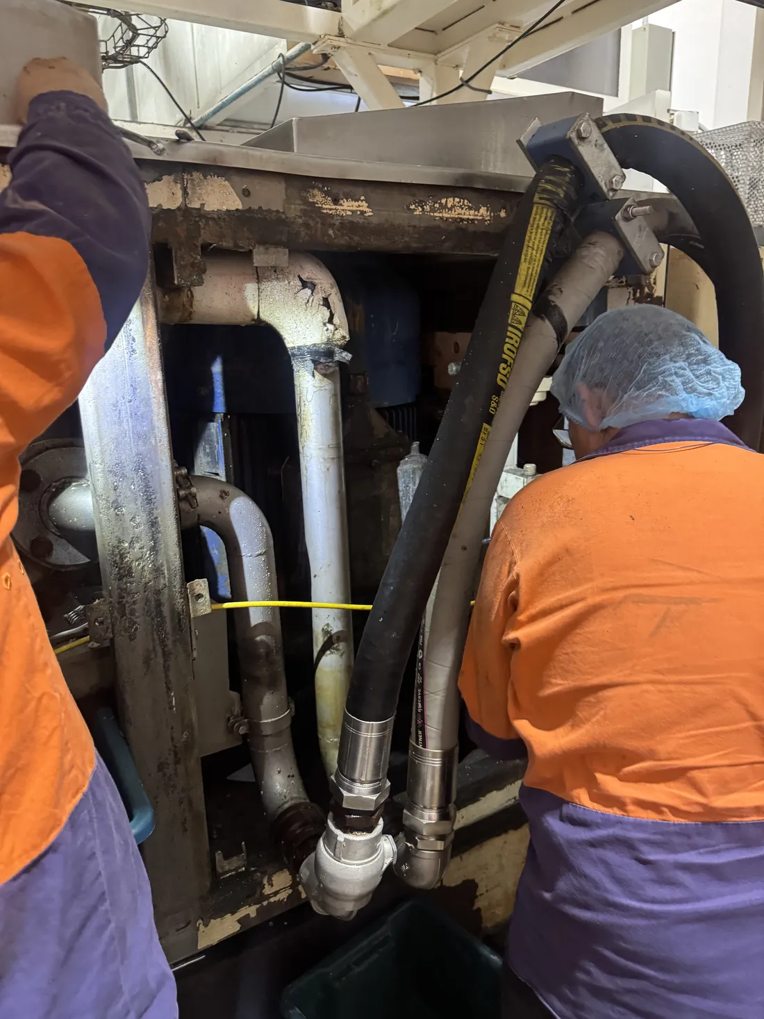 Sparktech electricians working alongside site staff on production plant